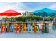 Inviting waterfront bar with colorful stools and shaded seating offers a relaxing spot for enjoying refreshing drinks at 5600 Beach Way Dr # 201, Sarasota, FL 34242