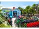 Charming blue rental shop, 'Robin Hood Rentals', with a variety of colorful bikes and scooters available at 5600 Beach Way Dr # 201, Sarasota, FL 34242