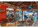 Interior of a restaurant with rustic wooden tables and chairs at 5600 Beach Way Dr # 201, Sarasota, FL 34242
