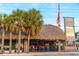 Exterior of Captain Curt's Tiki Bar Village with thatched roof at 5600 Beach Way Dr # 201, Sarasota, FL 34242
