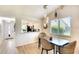 Inviting dining area with stylish lighting and comfortable seating next to kitchen at 6024 28Th W St, Bradenton, FL 34207