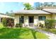 Inviting single-story home with a well-manicured lawn, decorative shrubs, and a cozy front entrance at 6024 28Th W St, Bradenton, FL 34207
