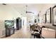Spacious living room featuring sleek furnishings, bright lighting, and seamless flow to other living spaces at 6024 28Th W St, Bradenton, FL 34207