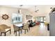 Open-concept living room featuring a dining area, comfortable seating, and plenty of natural light at 6024 28Th W St, Bradenton, FL 34207