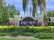 A welcoming sign for Old Mill Preserve with manicured landscaping at 6204 Horse Mill Pl, Palmetto, FL 34221