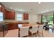 Stylish kitchen with a large island, granite countertops, and stainless steel appliances at 6204 Horse Mill Pl, Palmetto, FL 34221