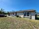 Charming single-story home with a well-maintained front yard, inviting entrance, and newer windows at 6405 Myrtlewood Rd, North Port, FL 34287