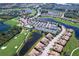 Expansive aerial shot of the neighborhood showcasing manicured lawns, a golf course, and serene lakes at 6515 Grand Estuary Trl # 208, Bradenton, FL 34212