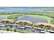 Beautiful aerial view of a low-rise condo complex overlooking a tranquil lake and lush golf course at 6515 Grand Estuary Trl # 208, Bradenton, FL 34212