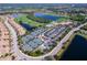 Exceptional aerial view of a resort-style community with tennis courts, pool, and golf course at 6515 Grand Estuary Trl # 208, Bradenton, FL 34212