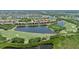 Gorgeous aerial perspective of a community bordering a lake and golf course, enhanced by native landscaping at 6515 Grand Estuary Trl # 208, Bradenton, FL 34212
