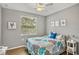 Inviting bedroom with nautical decor and a window bringing in natural light at 6515 Grand Estuary Trl # 208, Bradenton, FL 34212