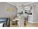 Cozy dining area with a wicker table set, adjacent to the kitchen at 6515 Grand Estuary Trl # 208, Bradenton, FL 34212