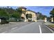 Stone-built entrance to a private residential community with manicured landscaping at 6515 Grand Estuary Trl # 208, Bradenton, FL 34212