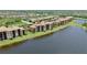 Waterfront condominiums featuring screened lanais with tranquil lake view at 6515 Grand Estuary Trl # 208, Bradenton, FL 34212