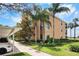 Well-maintained condo building with lush landscaping and covered parking at 6515 Grand Estuary Trl # 208, Bradenton, FL 34212