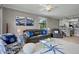 Well-lit living room with comfortable seating, open to the dining area and kitchen at 6515 Grand Estuary Trl # 208, Bradenton, FL 34212