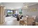 Open-concept living and dining area, featuring views of the lanai and pond at 6515 Grand Estuary Trl # 208, Bradenton, FL 34212