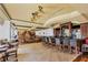 Relaxing bar and lounge area with comfortable seating, fireplace, and full bar at 7214 Marlow Pl, University Park, FL 34201