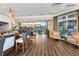 Stylish bar area with modern seating, wood floors, and open access to dining areas at 7214 Marlow Pl, University Park, FL 34201