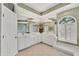 Bright bathroom featuring a large mirror, soaking tub, white cabinets and plenty of counter space at 7214 Marlow Pl, University Park, FL 34201