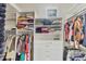 Spacious walk-in closet with custom shelving, drawers and abundant hanging space for storage and organization at 7214 Marlow Pl, University Park, FL 34201
