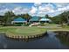 Stunning clubhouse with picturesque lake view and pristine green surroundings at 7214 Marlow Pl, University Park, FL 34201