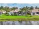 Beautiful home exterior with a screened-in pool and surrounded by lush landscaping at 7214 Marlow Pl, University Park, FL 34201