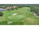 Aerial view featuring a well-manicured golf course and scenic greenery at 7214 Marlow Pl, University Park, FL 34201