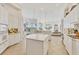Spacious kitchen boasts stainless steel appliances, center island and lots of natural light at 7214 Marlow Pl, University Park, FL 34201