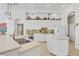 Open kitchen with a center island, stainless steel appliances and breakfast bar at 7214 Marlow Pl, University Park, FL 34201