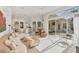 Open-concept living room with sliding glass doors to the backyard, perfect for entertaining at 7214 Marlow Pl, University Park, FL 34201