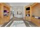 Community clubhouse lobby features carpet, wood shelving, and reception desk with view to the outside at 7214 Marlow Pl, University Park, FL 34201