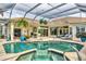 Inviting screened-in pool and lanai area complete with outdoor seating and a jacuzzi at 7214 Marlow Pl, University Park, FL 34201