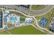 Bird's eye view of community amenities including pool, lounge area, and tennis courts situated next to the water at 7279 Kodiak Ln, Sarasota, FL 34240