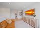 Cozy bonus room with comfortable seating, decorative console, and large wall-mounted television at 7279 Kodiak Ln, Sarasota, FL 34240