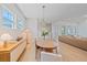 Open-concept dining room with light wood flooring, modern furnishings, and ample natural light at 7279 Kodiak Ln, Sarasota, FL 34240