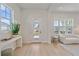Bright foyer with modern console table, stylish decor, and a view of the home's entrance at 7279 Kodiak Ln, Sarasota, FL 34240