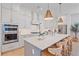Bright, modern kitchen with stainless steel appliances, a spacious island, and stylish pendant lighting at 7279 Kodiak Ln, Sarasota, FL 34240