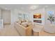 Bright living room with fireplace, modern decor, neutral colors and ample natural light at 7279 Kodiak Ln, Sarasota, FL 34240