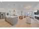 Open concept living space features stainless steel appliances, island, modern decor, and abundant light at 7279 Kodiak Ln, Sarasota, FL 34240