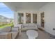 Covered outdoor patio with comfortable seating, ideal for relaxing and entertaining guests at 7279 Kodiak Ln, Sarasota, FL 34240