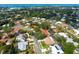 Aerial view showcases the property's pool, tile roof and proximity to the bay at 7460 Dickens Dr, Sarasota, FL 34231