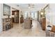 Open-concept living room and dining area with tile floors and stylish decor at 7460 Dickens Dr, Sarasota, FL 34231