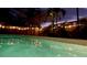 Inviting pool features underwater lighting, and is surrounded by a fenced yard, creating a private and relaxing atmosphere at 7460 Dickens Dr, Sarasota, FL 34231
