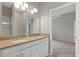 Bright bathroom featuring double vanity with granite countertops and a tiled walk-in shower at 7744 Castleisland Dr, Sarasota, FL 34240