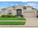 Charming single-story home with well-maintained landscaping and attached two car garage at 7744 Castleisland Dr, Sarasota, FL 34240
