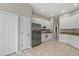 Large kitchen with stainless steel appliances, granite countertops and white cabinets at 7744 Castleisland Dr, Sarasota, FL 34240