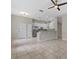 Bright open-concept kitchen featuring stainless steel appliances and granite countertops at 7744 Castleisland Dr, Sarasota, FL 34240