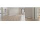 View of bright, neutral living room with tile flooring and recessed lighting at 7744 Castleisland Dr, Sarasota, FL 34240